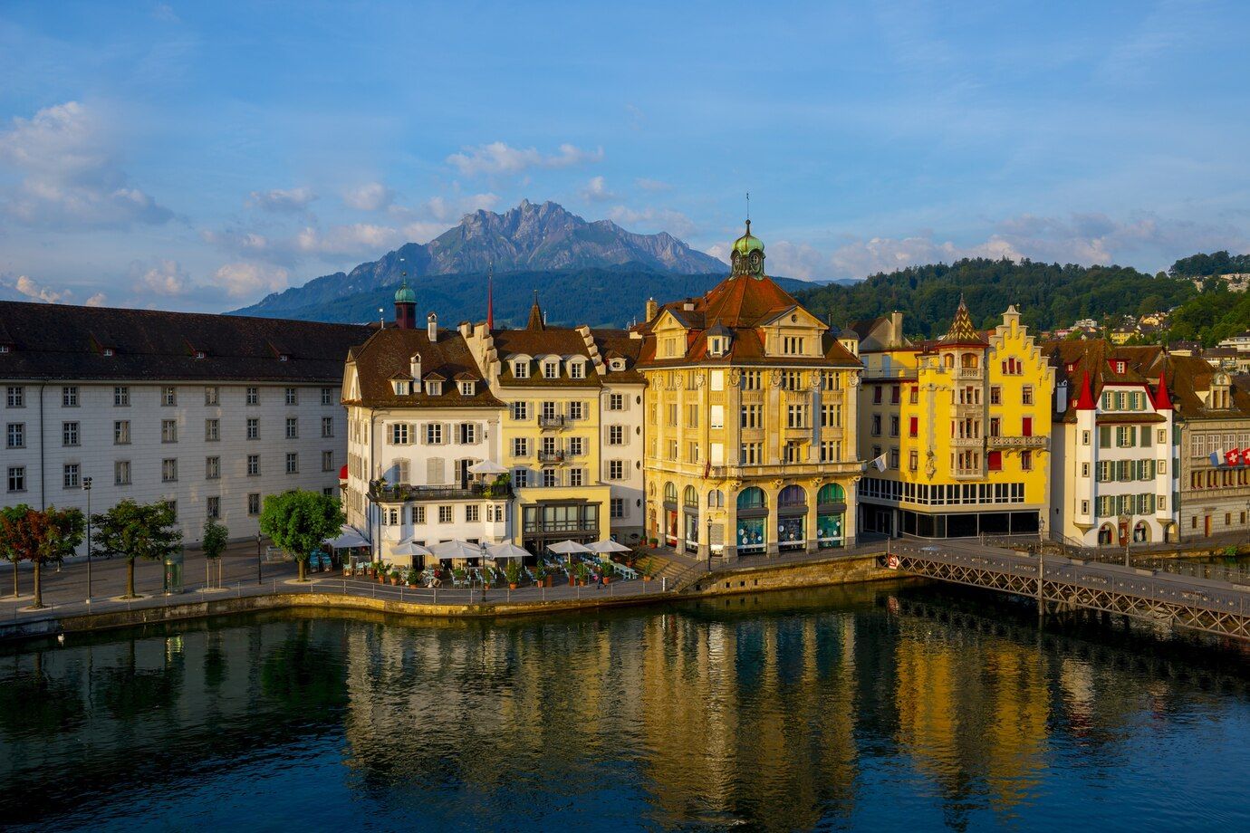 colorful-buildings-near-river-surrounded-by-mountains-lucerne-switzerland_181624-20791.jpg