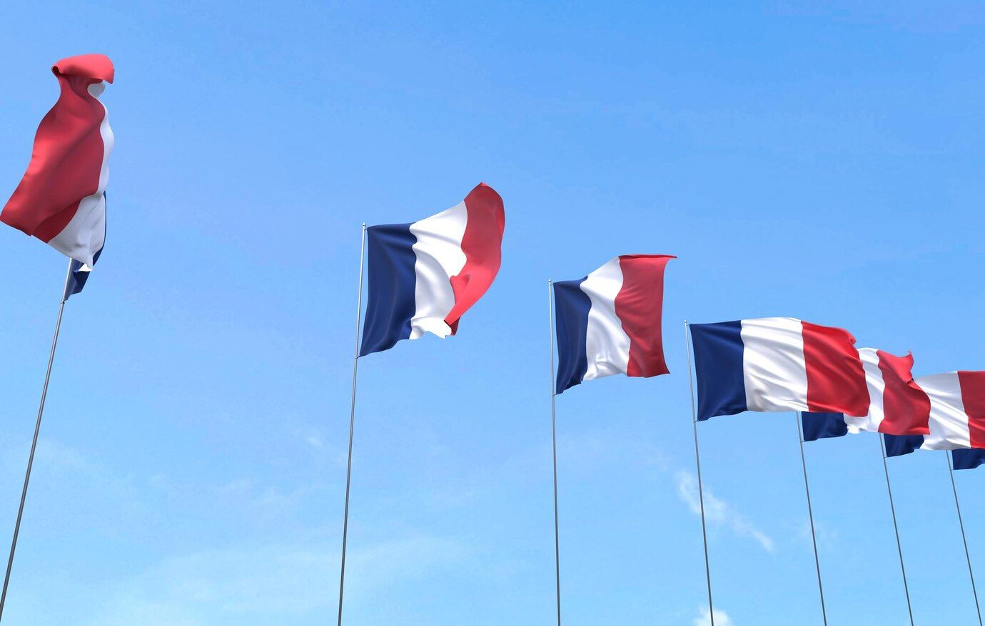 france-flag-waving-blue-sky-background_35913-3112.jpg