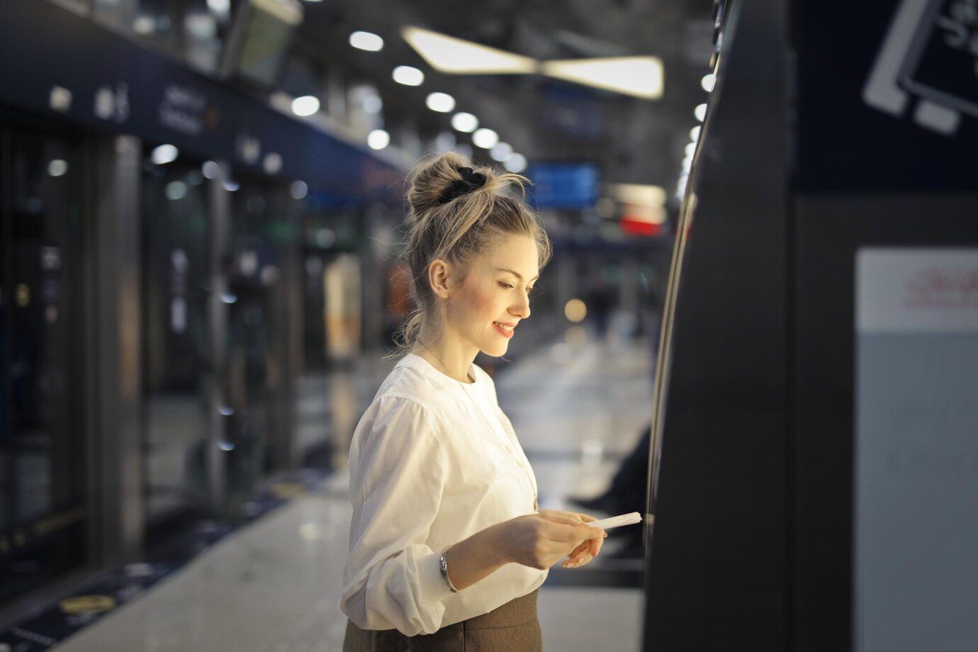 woman-buys-ticket-subway_641386-1181.jpg