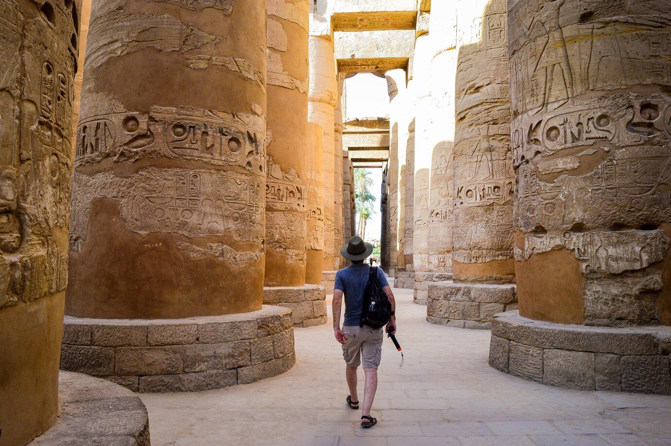 young-man-walking-egyptian-temple_181624-44493.jpg