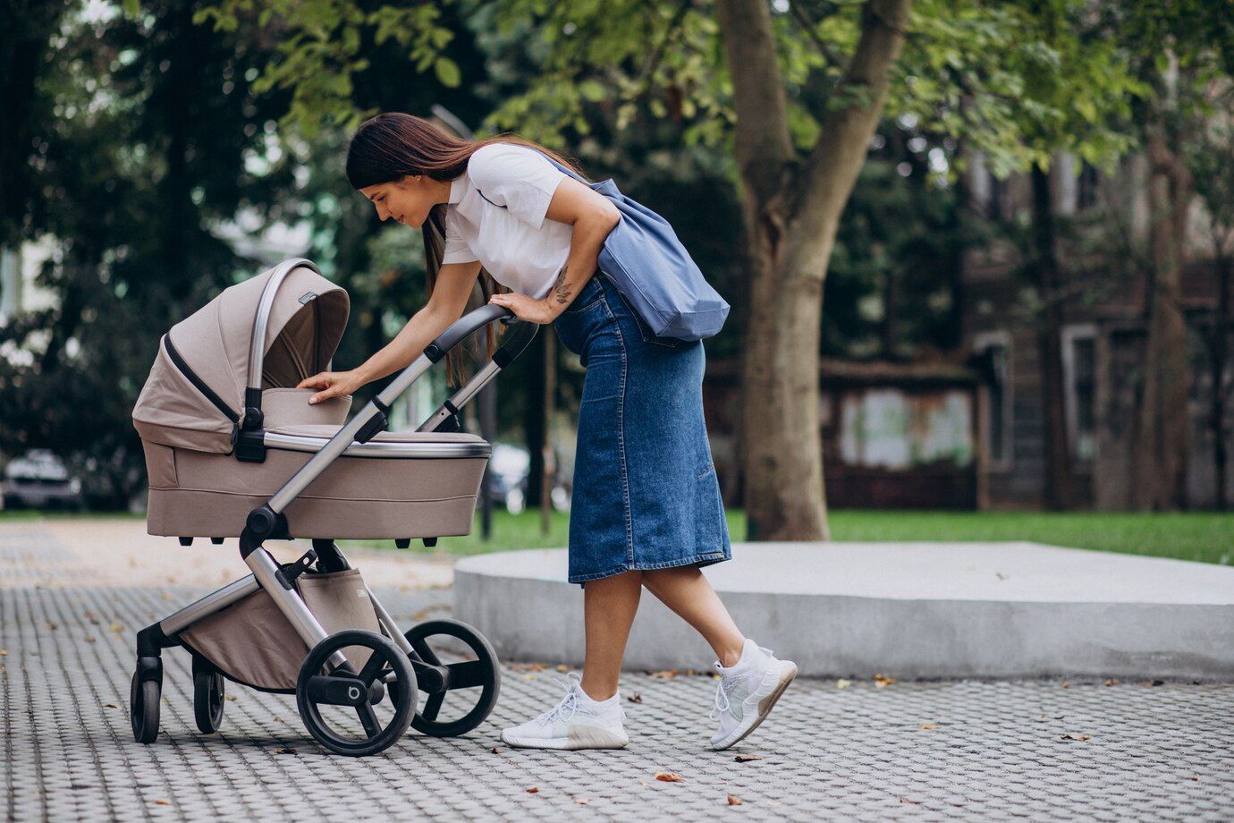 young-mother-walking-with-baby-stroller-park_1303-24223.jpg