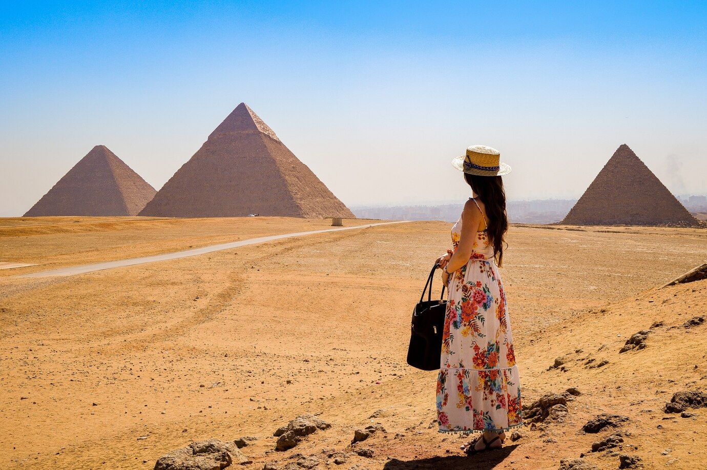 young-woman-visiting-pyramids-egypt_181624-45406.jpg